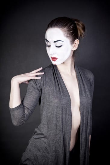 female mime on  black background
