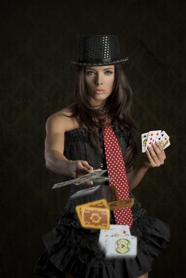 cute girl throwing poker cards